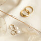 keira-30-braided-tapered-twisted-pearl-hoops-arielle-mia-rings-14k-gv-pearl-still-75-cropped